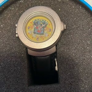 Disney Toon watch with spring loaded face in collector’s tin black leather band